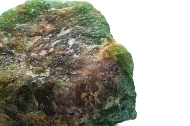 Raw uncut macro-focused Deep green Aventurine, green quartz crystal chunk isolated on a white surface background