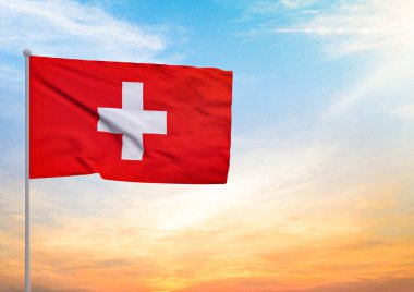 3D bir İsviçre bayrağının resmi bayrak direğine asıldı ve arka planda gün batımlı güzel bir gökyüzü.