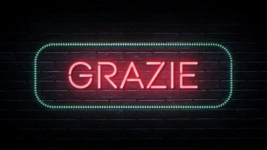 Kırmızı ve mavi renkli Grazie kelime animasyonu. Video tanıtımı ya da selamlama için uygun. Duvarın arkasında neon animasyon videosu, İtalyanca hoş kelimeler. 4K