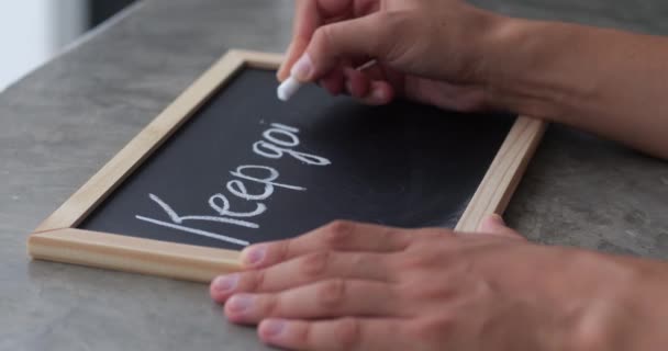 Female Hands Drawing Chalk Blackboard Motivational Phrase Keep Going Business — Stock Video
