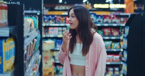 Young Woman Amazement Shows Emotions Looking Big Price Goods Supermarket — Stock Video