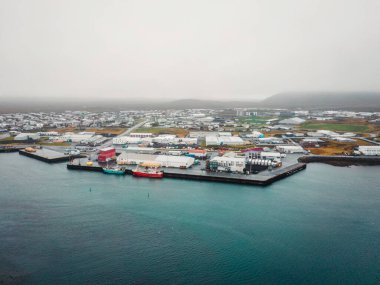 Grindavik fishing town by the sea in Iceland. Harbor by the sea. Cold autumn day in Iceland High quality photo clipart