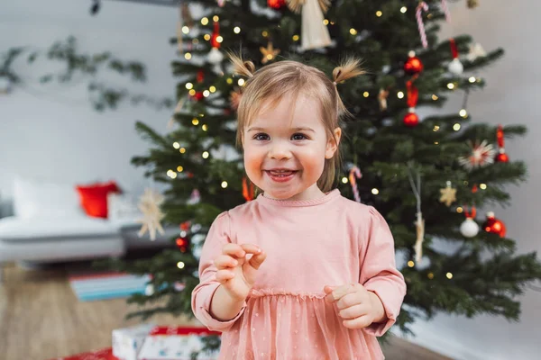Cheerful Young Girl Toddler Enjoying Some Lollipop While Decorating Christmas — Stock Fotó