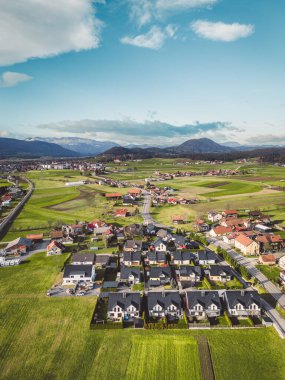 Drone view, aerial shoot of new build houses in the suburbs of Slovenia, somewhere in the country side, Europe. New modern houses, family homes.