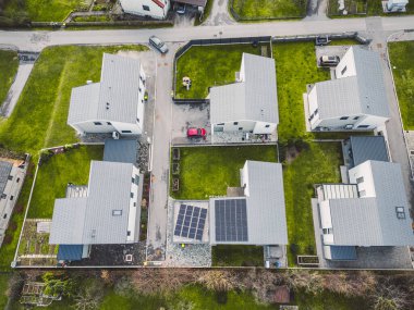 Drone view, aerial shoot of new build houses in the suburbs of Slovenia, somewhere in the country side, Europe. New modern houses, family homes.