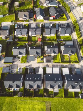 Drone view, aerial shoot of new build houses in the suburbs of Slovenia, somewhere in the country side, Europe. New modern houses, family homes.