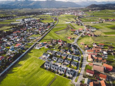 Drone view, aerial shoot of new build houses in the suburbs of Slovenia, somewhere in the country side, Europe. New modern houses, family homes.