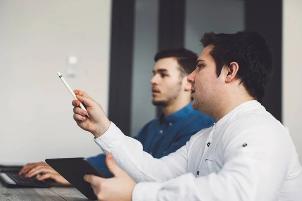 stock image IT Programmer Working on Desktop Computer. Male Specialist Creating Innovative Software Engineer Developing App, Program, Video Game. Terminal with Coding Language. Over Shoulder. High quality photo