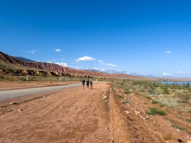 The Running Men at Issykkul Lake. clipart