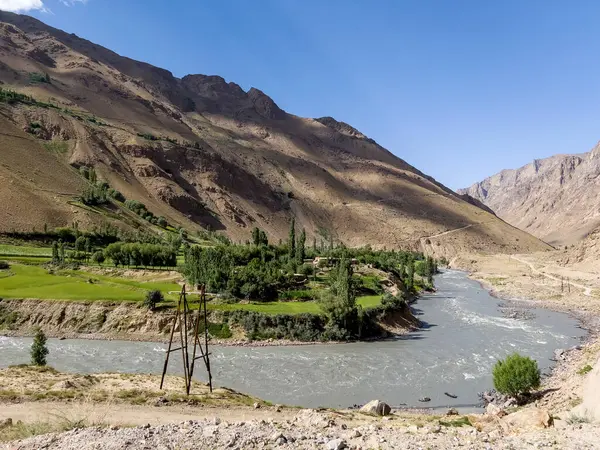 Stock image A small Afghan village on the Panj River.