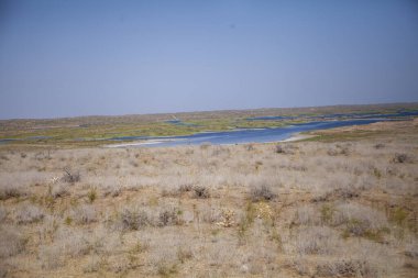 a blue water body in uzbekistan clipart