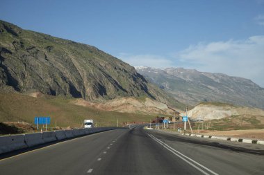 a mountain side road in uzbekistan clipart