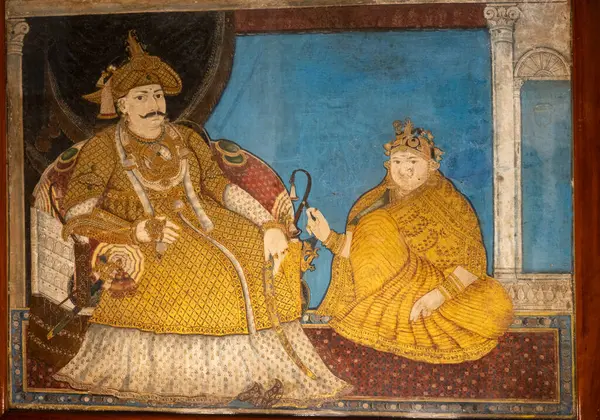 Chennai, Tamil Nadu, Hindistan - 02.07.2025: Bir erkek ve bir kadının resmi. Adam bir sandalyede oturuyor ve kadın da yerde oturuyor. Chennai 'de.