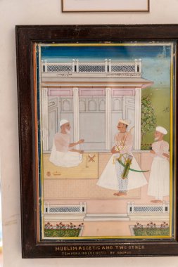 Chennai, Tamil Nadu, Hindistan - 02.07.2025: Beyaz cüppeli üç adamın resmi. Tablonun adı 