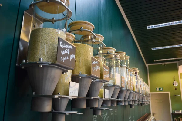 Bulk food dispenser bins in store on sustainable zero waste eco friendly market
