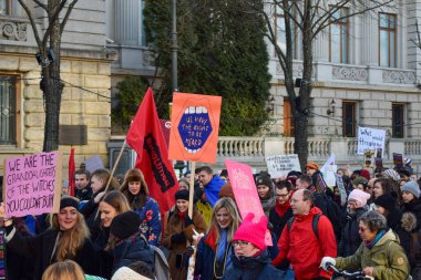 BERLIN, GERMANY - 19.01.2018: Several feminist protesters participate in a strike against gender violence holding banners in commemoration of March 8 in Madrid