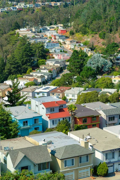 stock image sprawling colorful neighborhood in suburban san francisco california midday in sun lined with trees and foliage in city