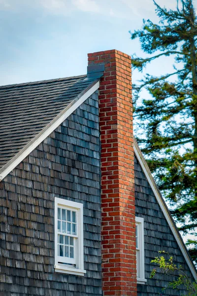 Wooden Slatted House Facade Roof Red Brick Chimney White Painted Royalty Free Stock Photos