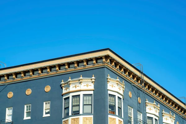 Blue Stucco Building Golden Decorative Facade White Accent Paint Windows — Stock Photo, Image