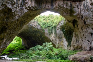 Panoramic view inside the Devetashka Cave near Devetaki village and Osam river in Bulgaria clipart