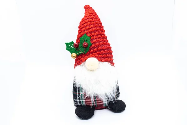 白い背景に赤い帽子のクリスマスのノーム ロイヤリティフリーのストック写真