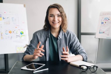 Professional and Engaging: Beautiful Business Woman Conducting a Video Conference, Communicating and Connecting with Confidence Through Web Camera, Whether in the Office or from the Comfort of Home clipart