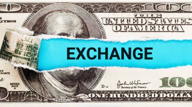 Exchange. The word Exchange in the background of the US dollar. Financial Market Trading Activity and Data Analysis in Modern Economy Setting. Torn bills the US dollar that say 