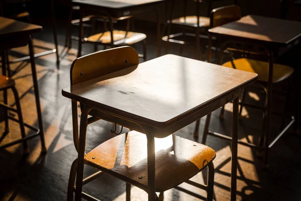 Wooden school chairs and desks in an empty Japanese school classroom