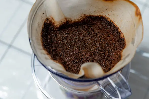 Hand drip coffee filter with uses coffee grounds