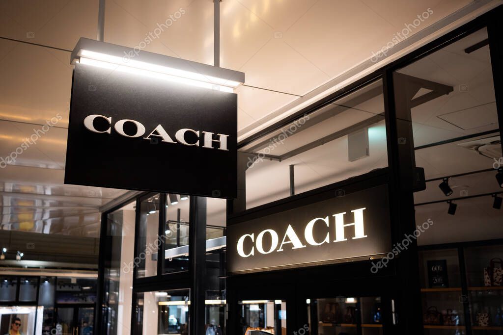 Coach outlet store storefront logo and banner.