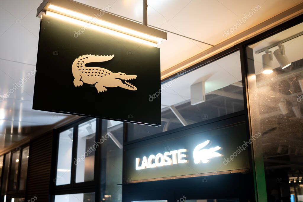 Lacoste outlet store storefront logo and banner
