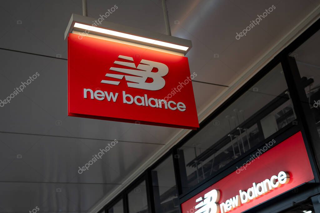 New Balance outlet store storefront and logo