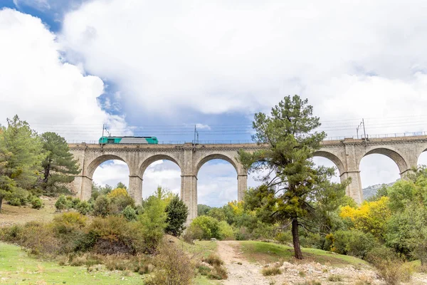 stock image railway bridge that crosses the cofio river in the Sierra de Guadarrama, Madrid