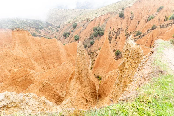 stock image valley eroded, over the centuries, between the provinces of guadalara and madrid in spain, called las carcavas, covered by fog