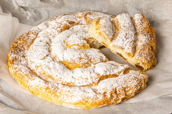 stock image Typical dessert from Mallorca, Spain, called ensaimada based on flour, eggs, butter, sugar and some variety with angel hair