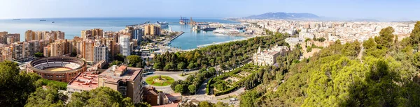 stock image Malaga bullring among the surrounding buildings in the city center in Malaga, Spain