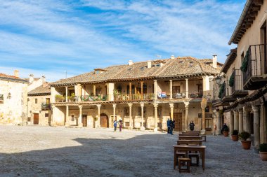 main square and details of the historic buildings of the city of Pedraza in the province of Segovia, Spain