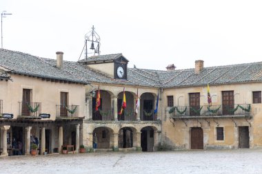 main square and details of the historic buildings of the city of Pedraza in the province of Segovia, Spain