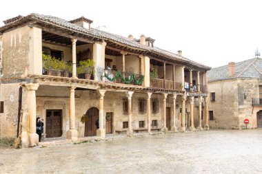 main square and details of the historic buildings of the city of Pedraza in the province of Segovia, Spain