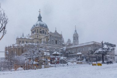Almudena Cathedral in madrid theater covered by snow from the storm philomena