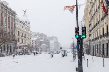 Snowscape in a street in Madrid due to the snowstorm Filomena in street alcala