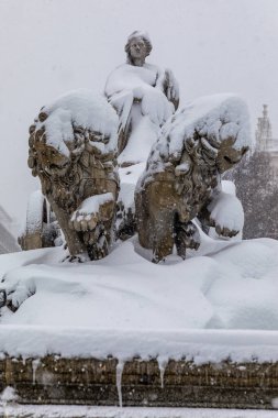 Snowscape in a street in Madrid due to the snowstorm Filomena in fountain cibeles