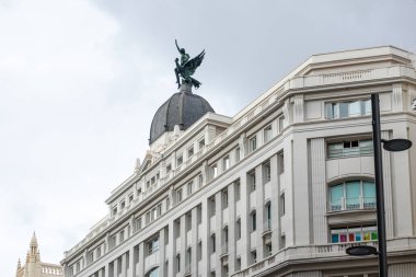 details of the historic buildings in the center of Madrid, specifically the gran via street