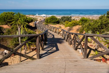 wooden walkways to access the beach of La Barrosa, Cadiz, Spain