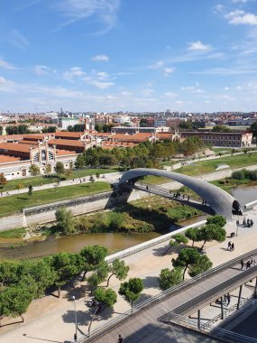 Manzanares River of Madrid as it passes through the old Slaughterhouse area, today a zone dedicated to cultural events clipart