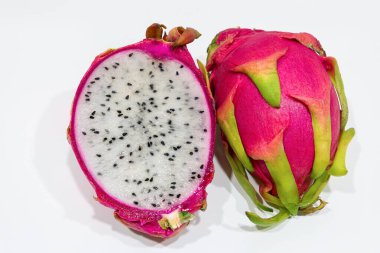 Delicious cut dragon fruit pitahaya on wooden table, closeup