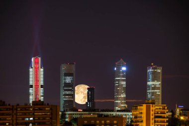 Super moon at Four Towers Skyline. Madrid, Spain.