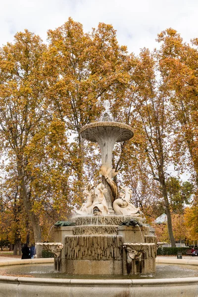statues in the retiro park in madrid in autumn