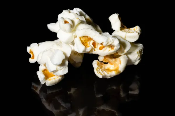 macro photography of popcorn on a black background