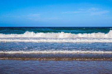 Parasols and hammocks on La Barrosa beach in Sancti Petri, Cadiz, Spain